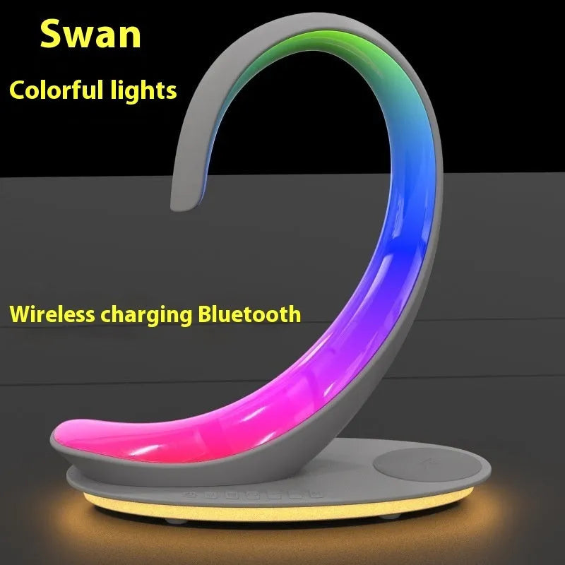 White swan shaped desktop wireless charger with Bluetooth speaker and colourful ambient lighting