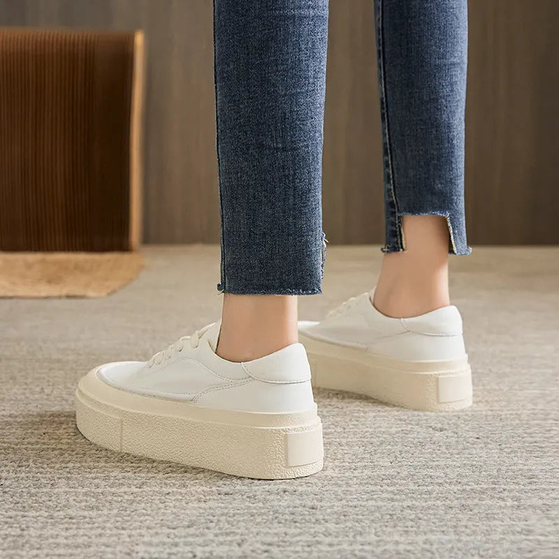 Women's tied platform sports board shoes in black with round toe, cowhide upper, and rubber sole