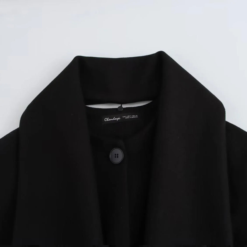 Women's long camel coat with a detachable artificial fur collar in a street fashion style.