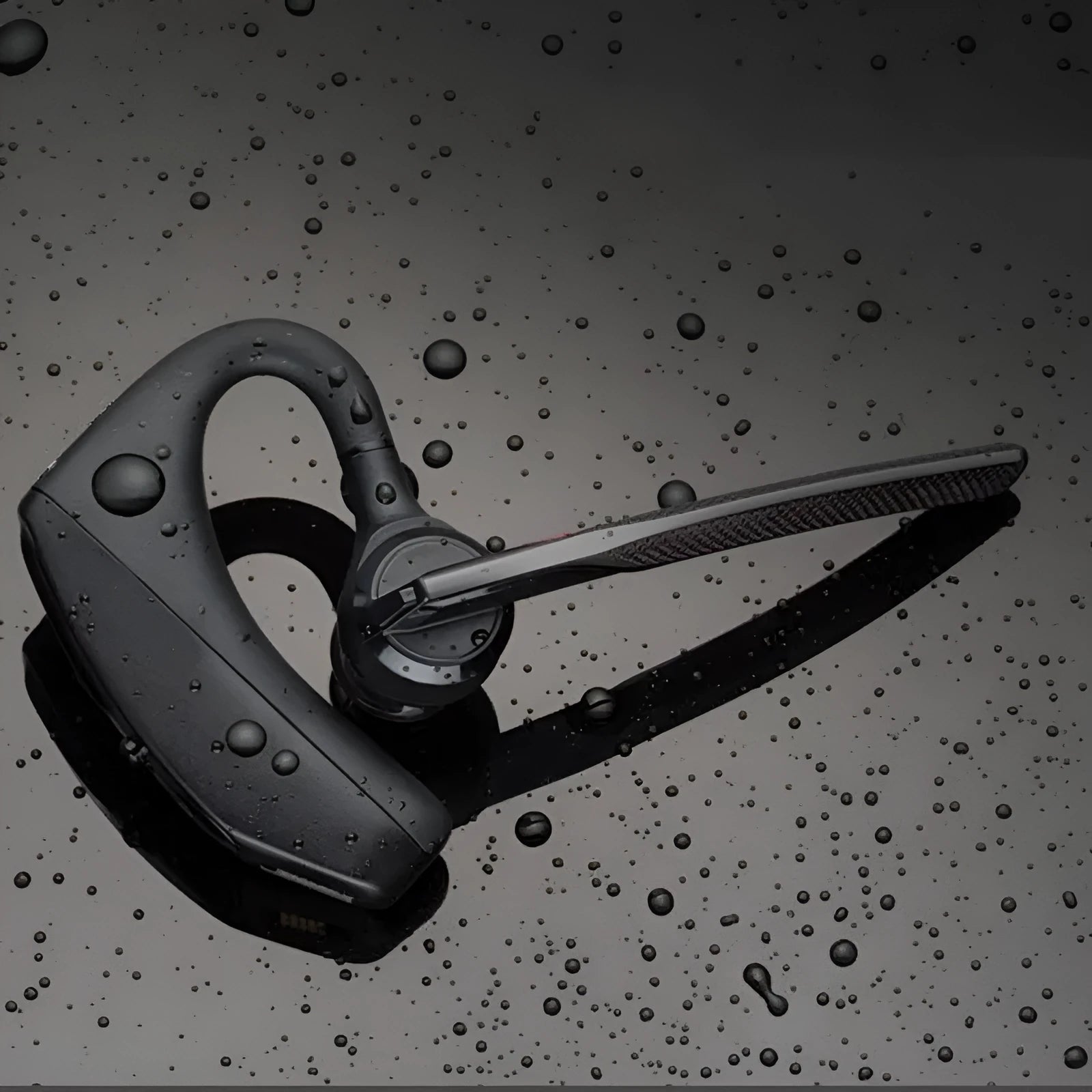 Black Bluetooth sports in-ear headphones with a plastic housing and visible USB port.
