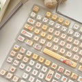 Set of 140 PBT plastic keycaps for mechanical keyboards in EOA height with Rabbit Bear Restaurant graphics.