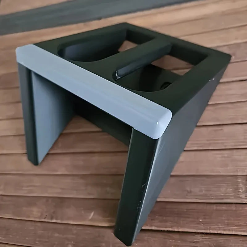 Black plastic punk-style pistol stand for displaying decorative firearms