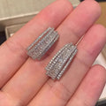 Geometric shaped white gold colour stud earrings with inlaid zircon stone for women.