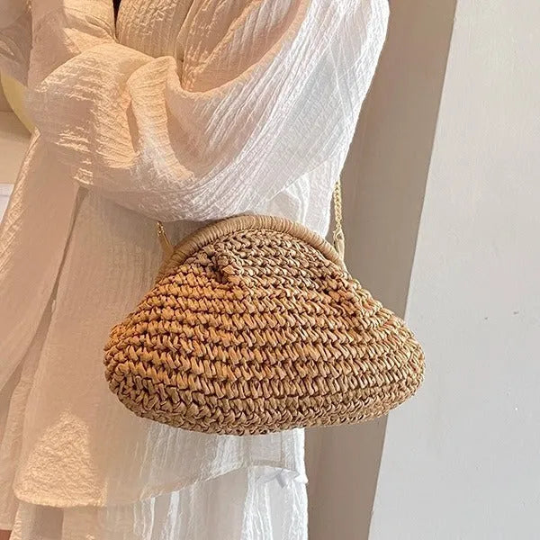 Khaki shell-shaped straw shoulder bag for women with chain detail and zippered pocket.