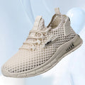 Men's beige casual sneaker with synthetic leather upper and mesh lining, featuring a flat low-heel sole and lace-up front.