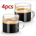 White transparent glass double mouth coffee cup on a flat surface, showing its simple modern design
