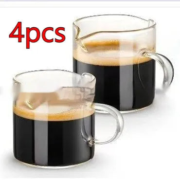 White transparent glass double mouth coffee cup on a flat surface, showing its simple modern design