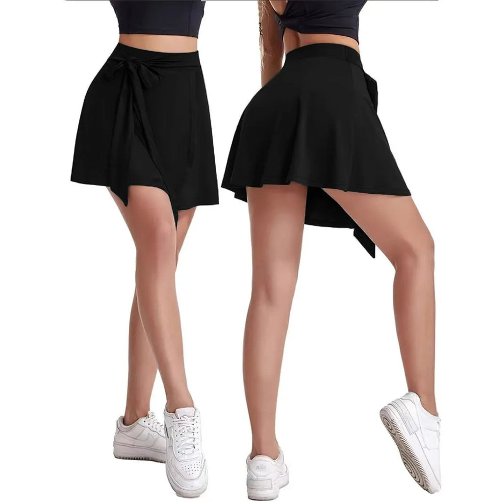 Black thigh-length sports skirt with built-in shorts, high waist, and shoulder strap design