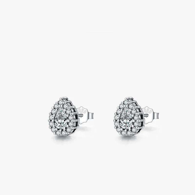 Silver drop-shaped ear studs with diamond-cut surface detail on 925 sterling silver