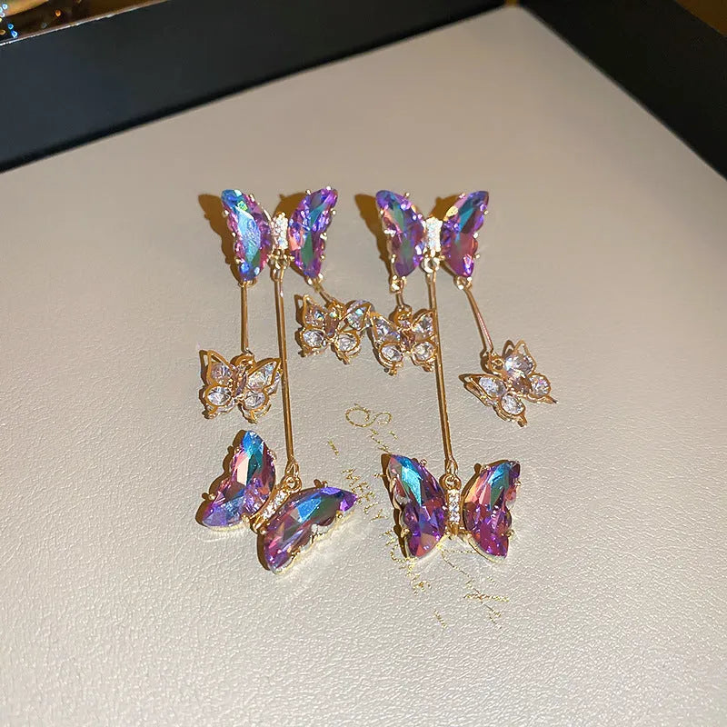 Electroplated blue purple butterfly tassel earrings with silver needle crystal flowers for women.