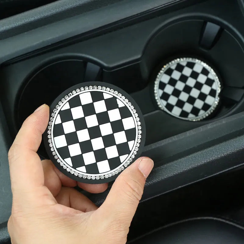 Black and white checkerboard PVC non-slip car water cup mat on a cup holder
