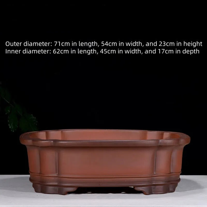 Large antique-style purple clay flowerpot with Chinese design for outdoor garden use.
