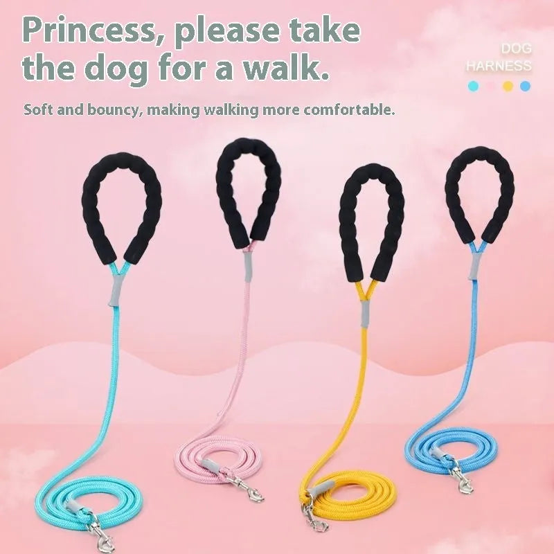 A colourful dog walking vest harness with an attached lead rope, shown in blue, green, pink, or yellow.