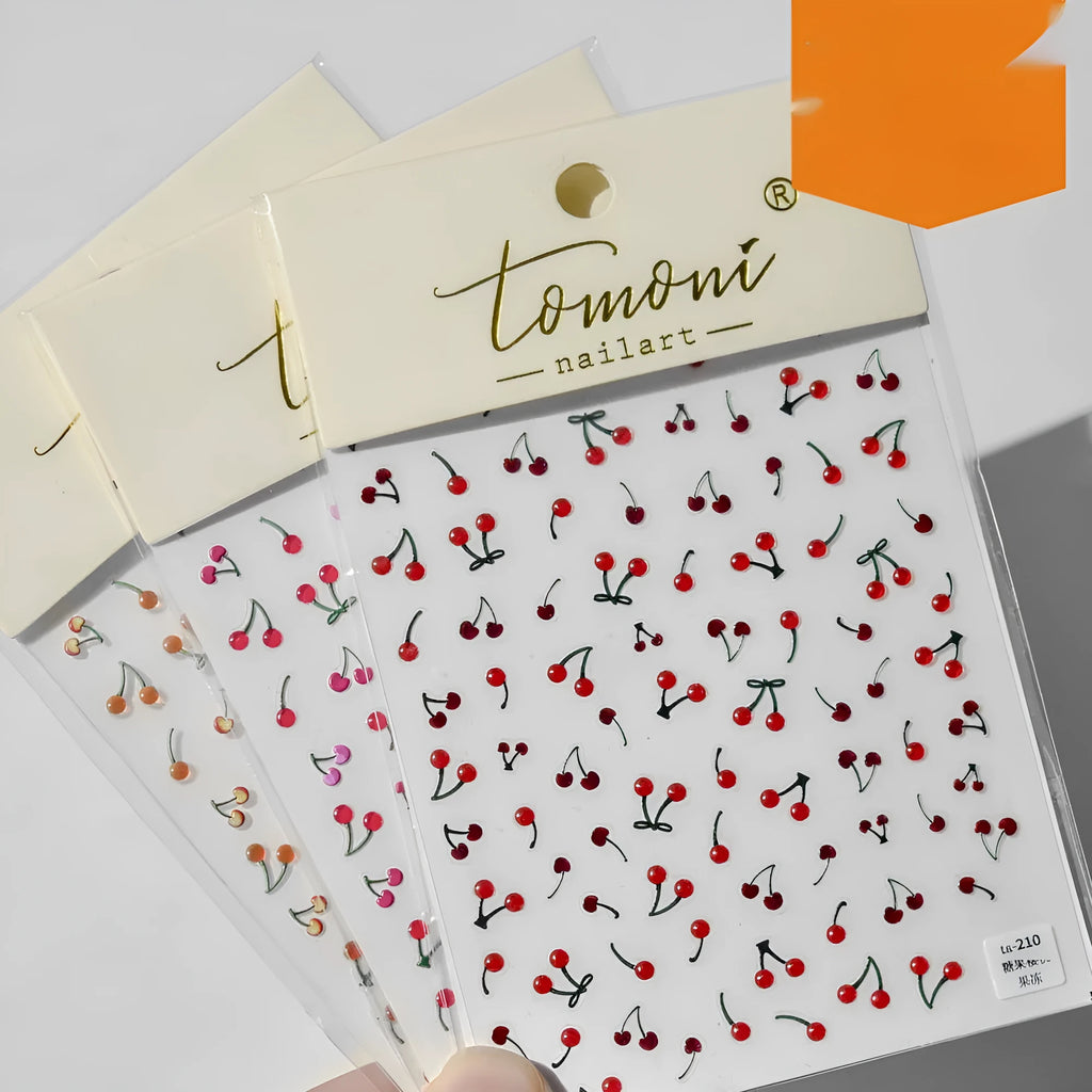 Jelly nail art sticker sheet with multiple cartoon cherry designs on a clear plastic backing