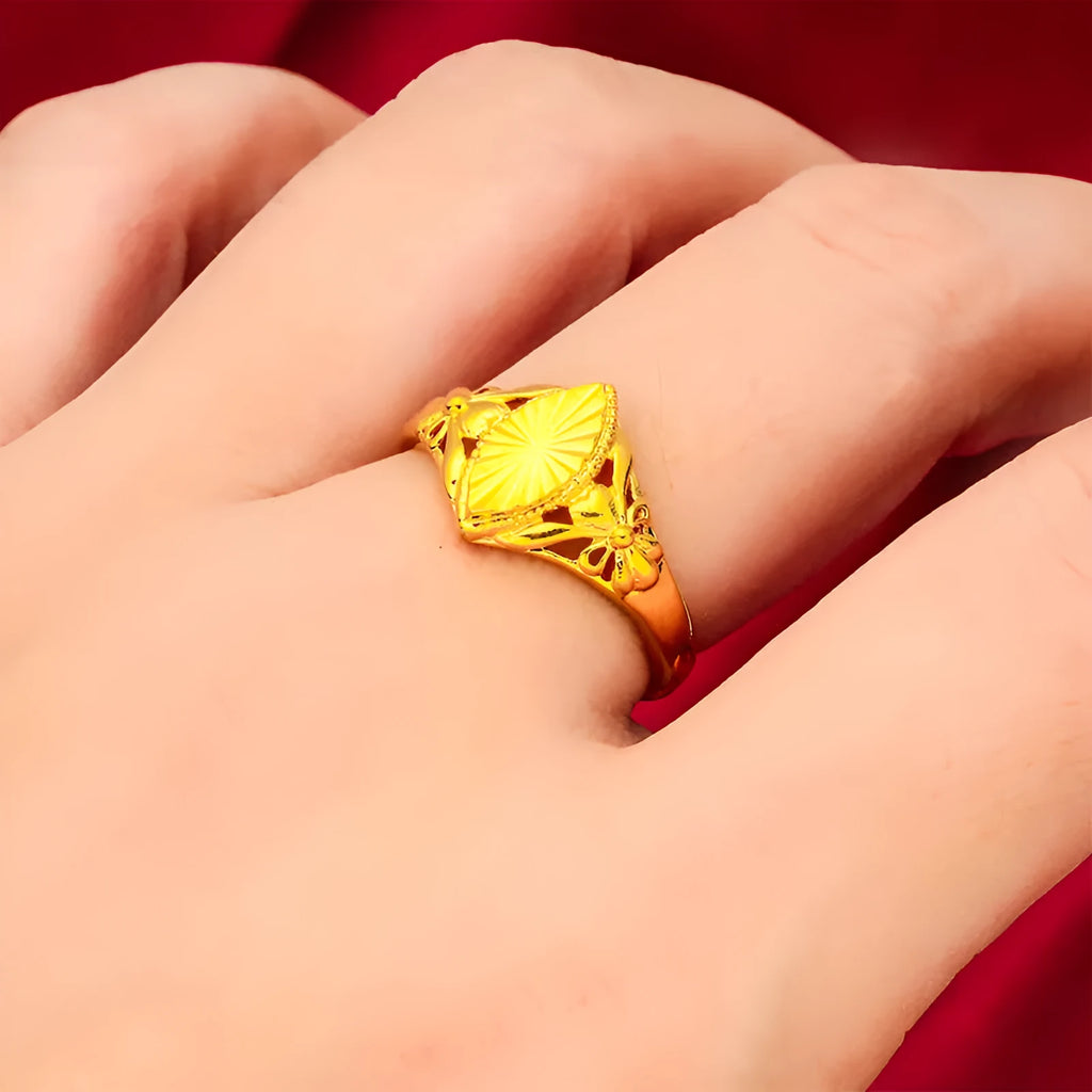 Gold coloured electroplated brass ring with open diamond flower geometry design and texture details