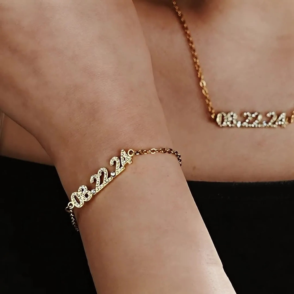 Stainless steel digital bracelet with diamond-set numbers on display, shown in gold tone.