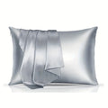 A pair of solid colour satin cloth pillowcases in wine red, shown folded to display their size and smooth texture.