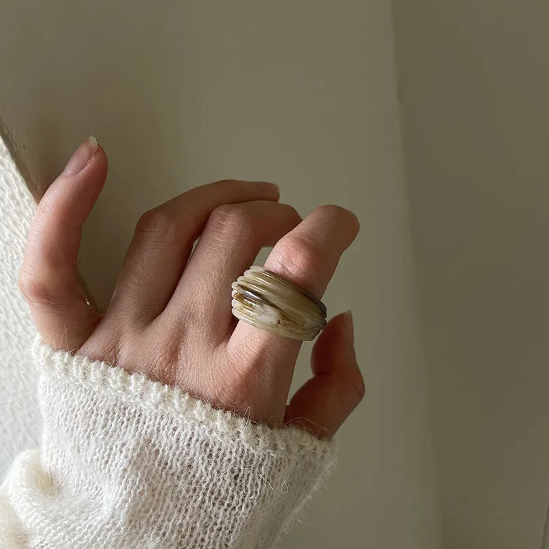 Geometric irregular resin wide ring in Maillard Brown, Smoky Brown, and Latte White colours