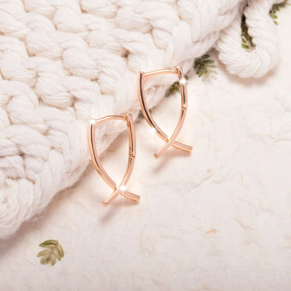 Rose gold plated copper cross shaped earrings with light luxury design
