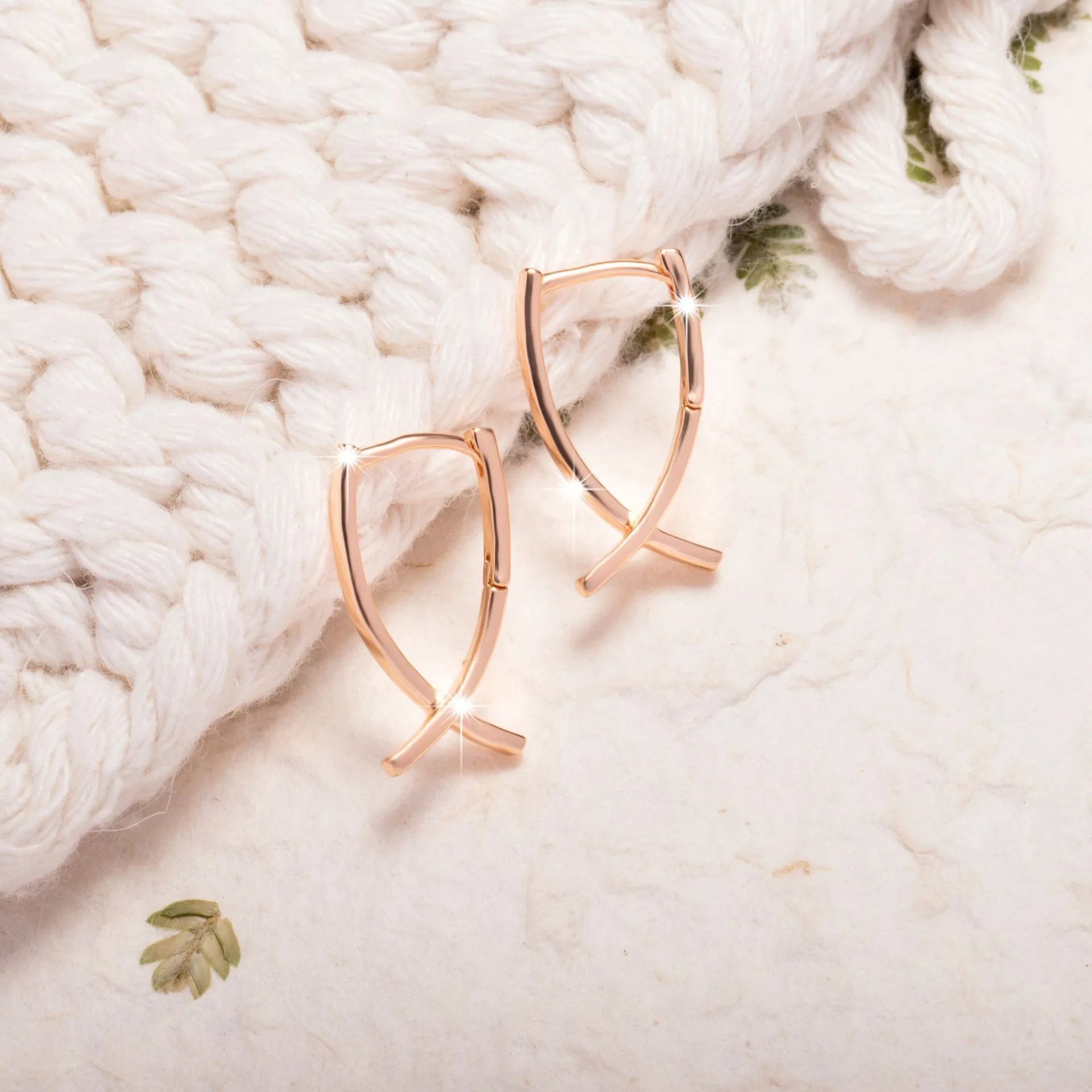 Rose gold plated copper cross shaped earrings with light luxury design