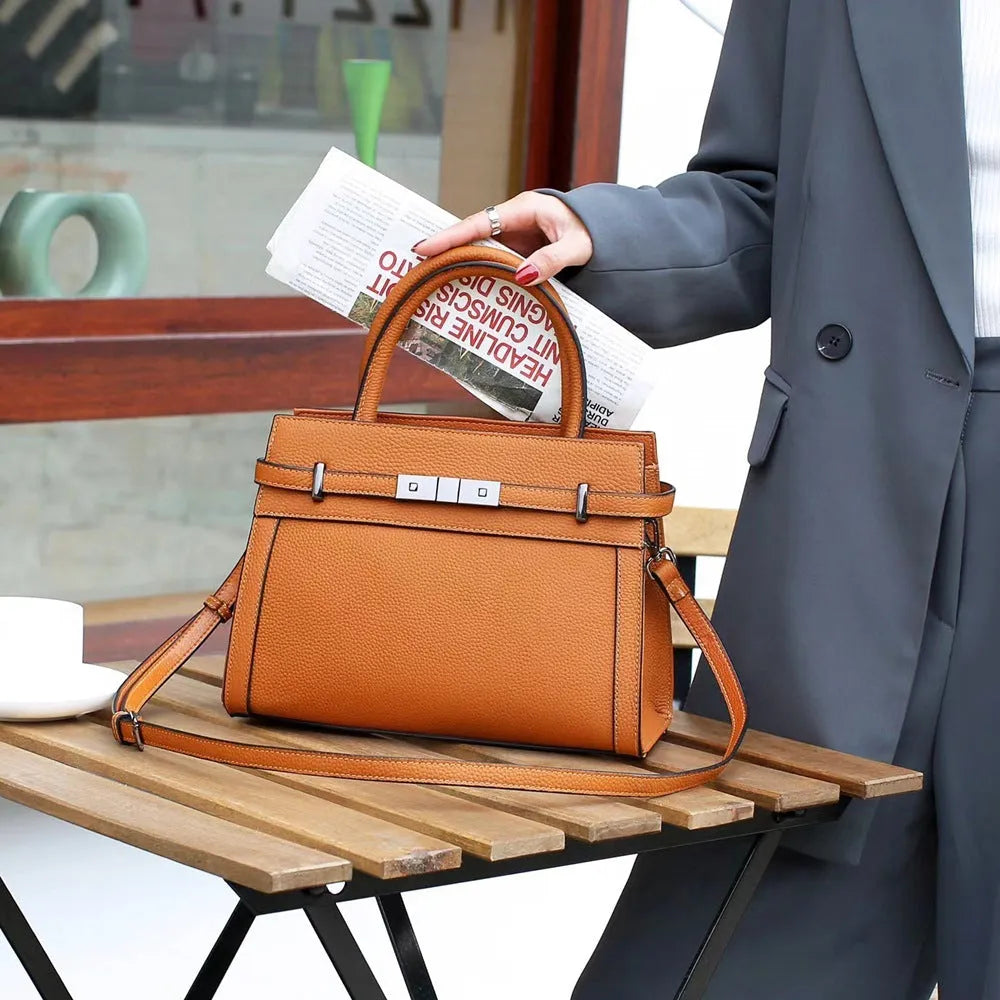 Genuine leather horizontal square shoulder bag with internal pockets in almond green colour.