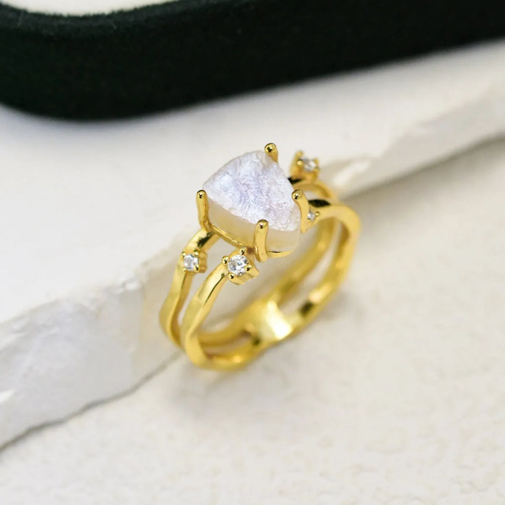 S925 silver geometric ring with irregular triangle design and moonstone, shown in rose gold finish.