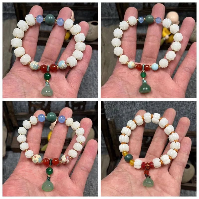 Hand-carved bodhi root bracelet with pumpkin lotus beads, white jade accents, and cat claw pendant