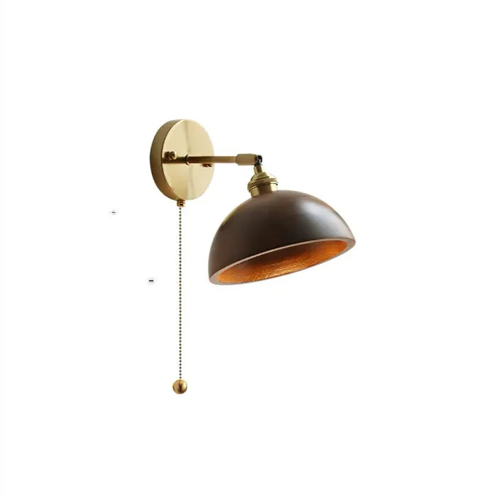 Inn Niche walnut-colour Nordic wall lamp mounted above a bedside table