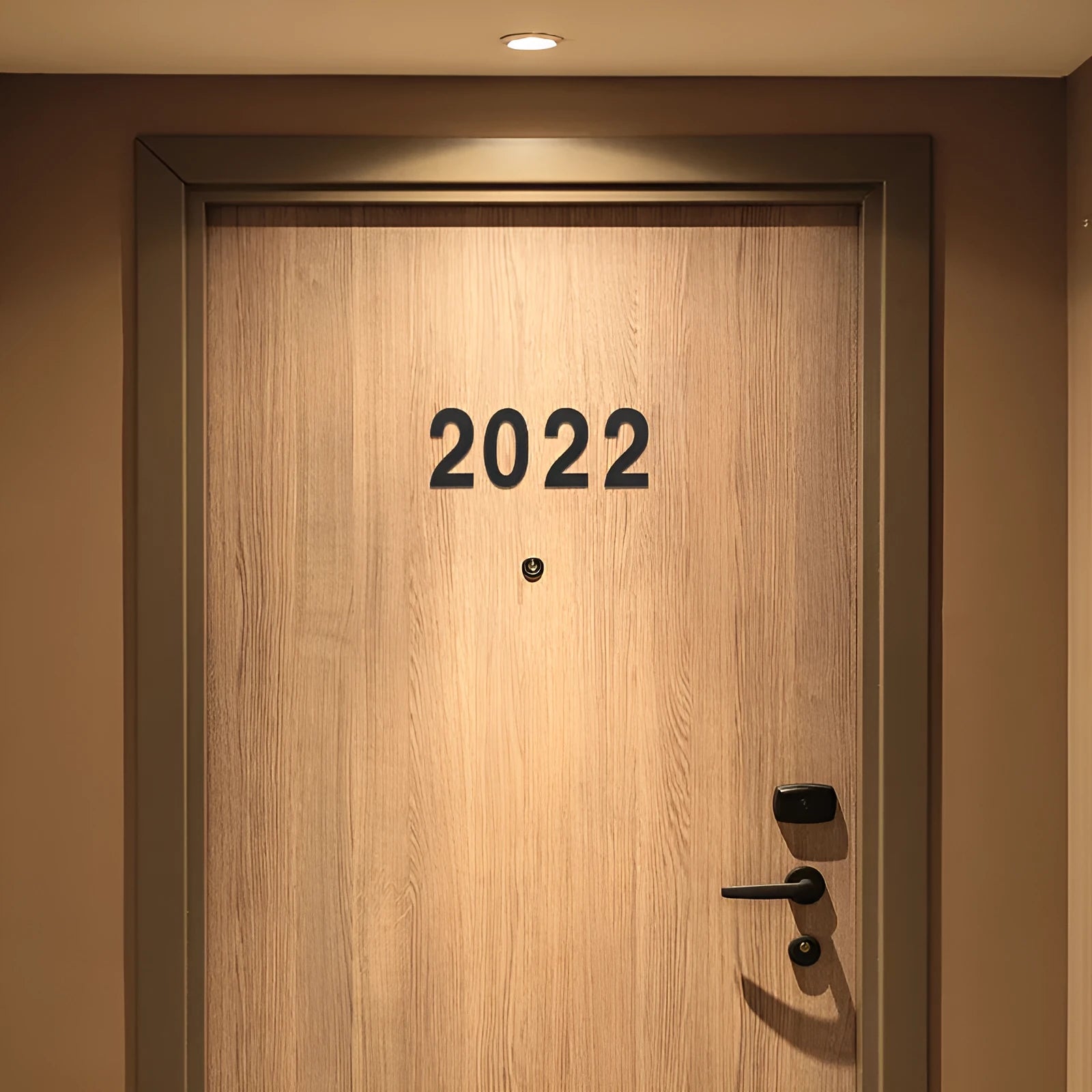 Black stainless steel adhesive-backed house number or letter, 7.5cm tall, for outdoor door or wall.
