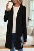 Long sleeve loose grey knitted cardigan jacket with pockets on a hanger