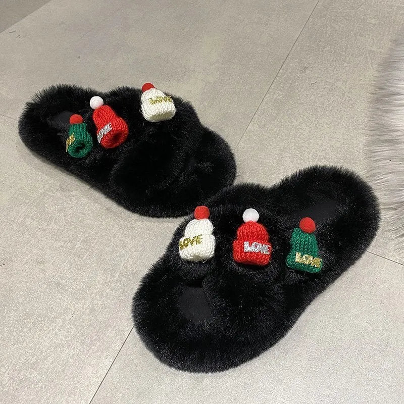 Women's slippers with a Christmas hat decoration on a super hairy faux plush upper, shown in black.
