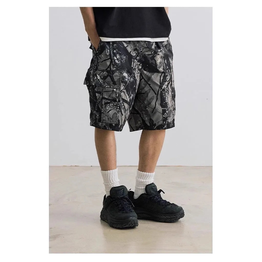 Men's loose fit straight-leg denim shorts in army green on a plain background.