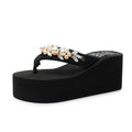 Women's high-heeled wedge flip-flop sandals with a cotton cloth upper in beige and black.