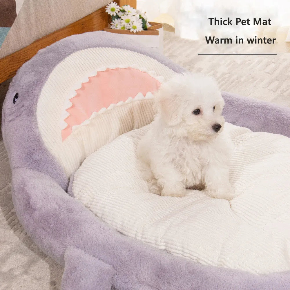 Blue shark pattern velvet pet bed cushion with thick padding on a wooden floor