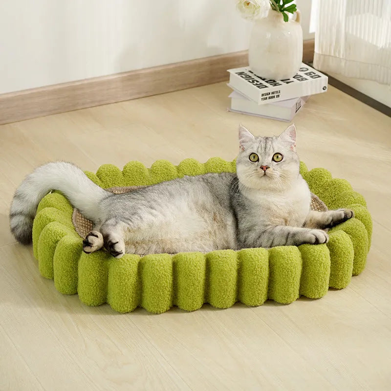 Green oval cat scratch pad and bed made from sisal measuring 650x420x100mm