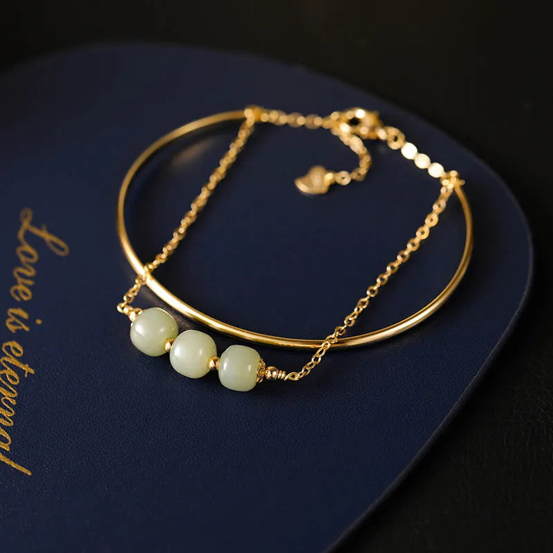 Hetian jade lucky beads bracelet with gold inlay, shown in single, double, and three bead versions.