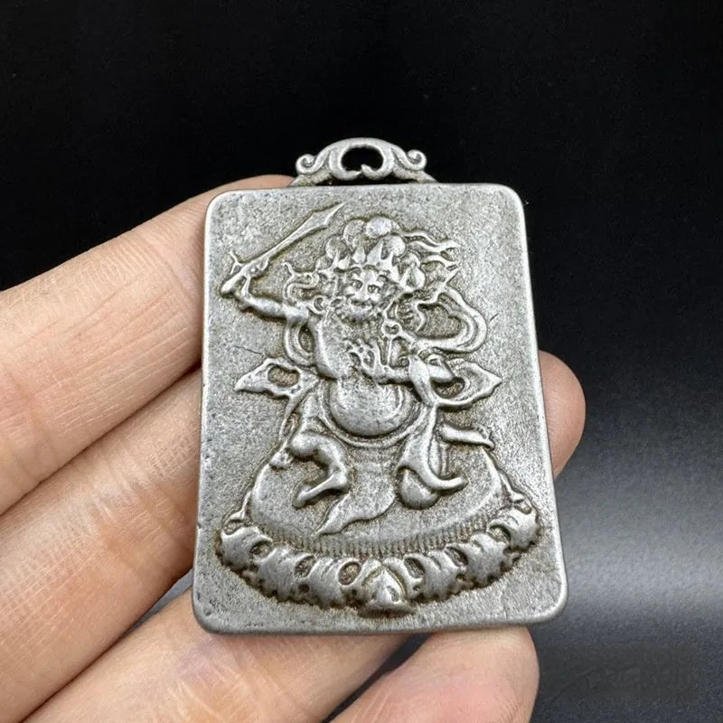 Iron metal pendant ornament with Chinese geometric style and Yamantaka deity depiction.
