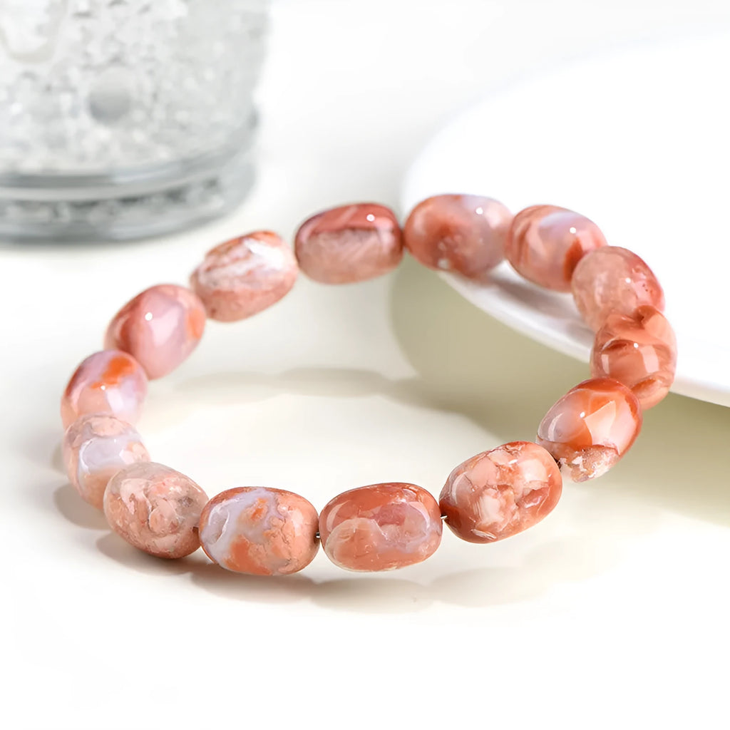 Natural cherry agate bracelet with 10x14mm barrel beads and Ruyi decorative elements