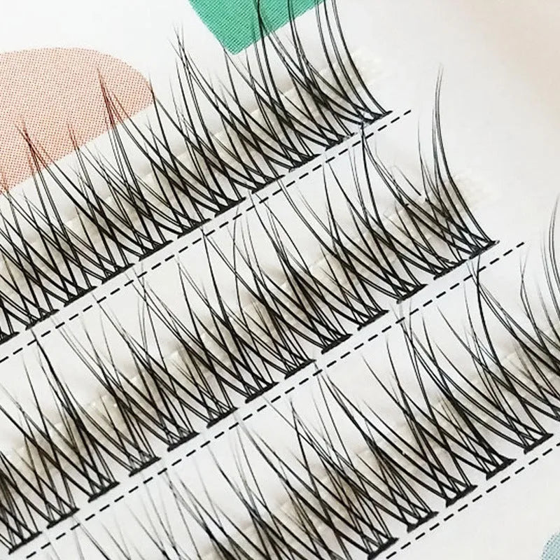 Black V-shaped fairy fishtail false eyelashes showing thick segment design.