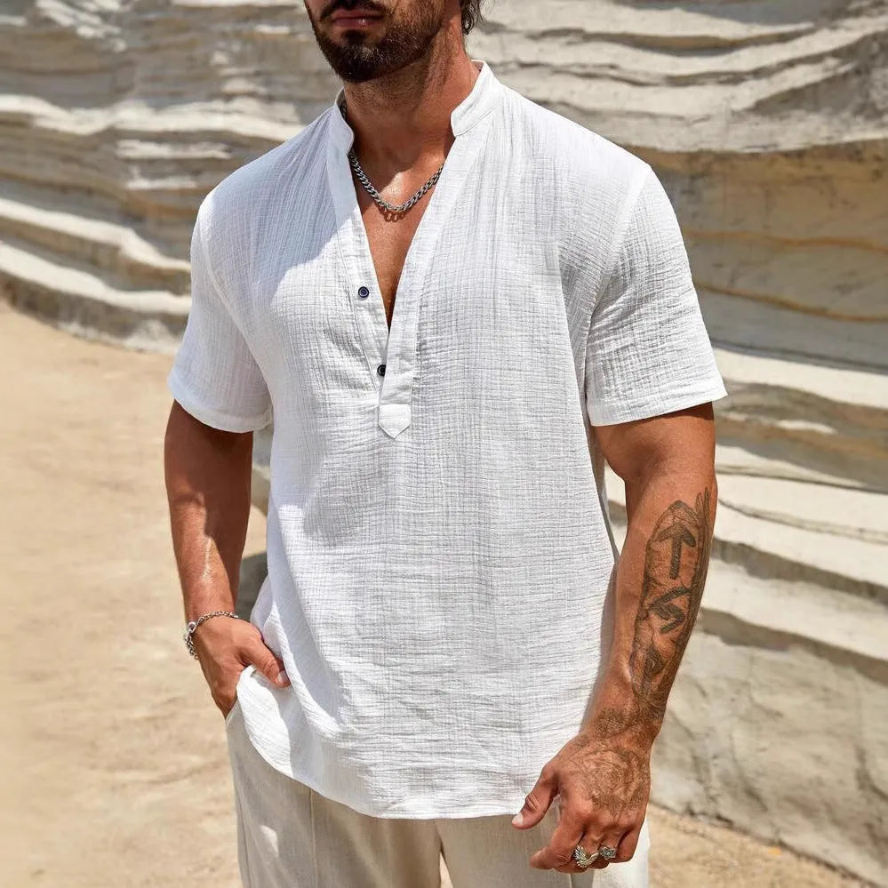 Men's solid colour stand collar short-sleeved shirt in a light blue shade on a hanger.