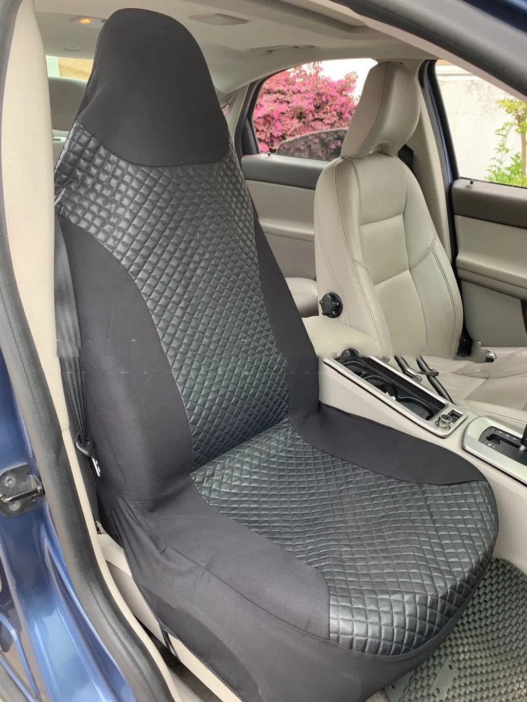 Black quilted automotive seat cover made from PU and polyester fabric with plastic attachment hooks