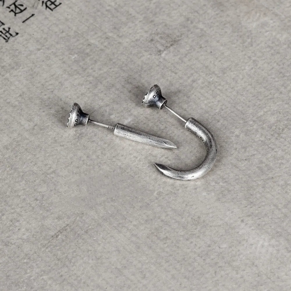 Sterling silver nail stud earrings in straight and curved punk styles on ear hooks