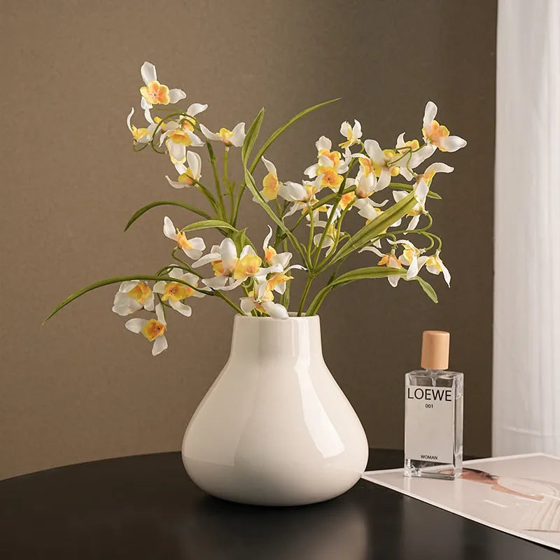 Round belly French design ceramic vase in coloured glaze finish with artificial orchid flowers