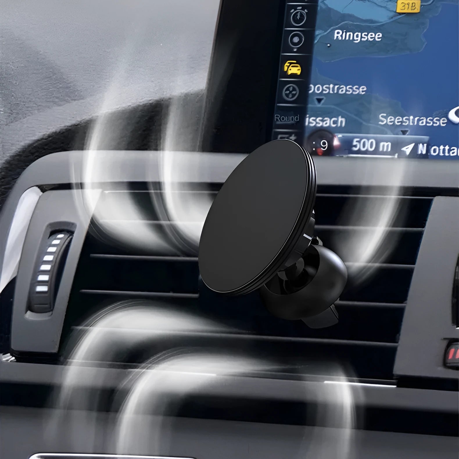Black aluminium alloy magnetic car phone holder attached to car air vent