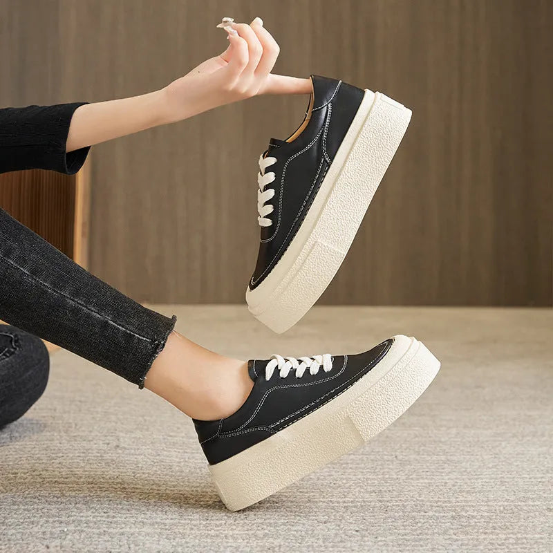 Women's tied platform sports board shoes in black with round toe, cowhide upper, and rubber sole