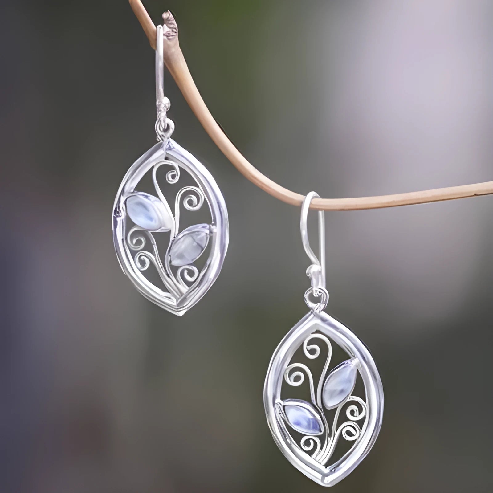 Silver women's earrings with leaf design and colourful embedded moonstones