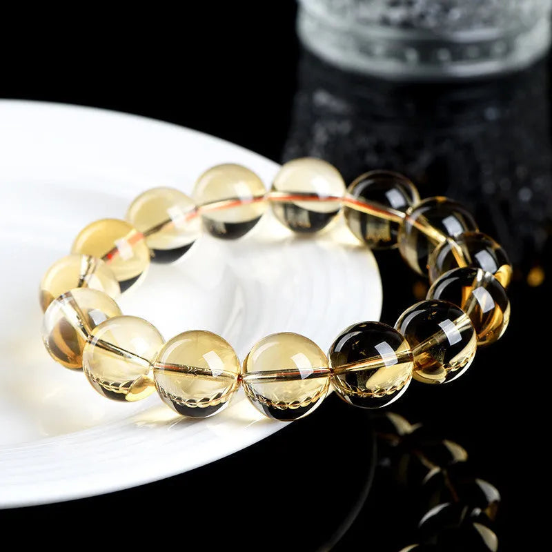 Natural citrine scattered beads ball bracelet in 7A and 6A colour grades on a white background.