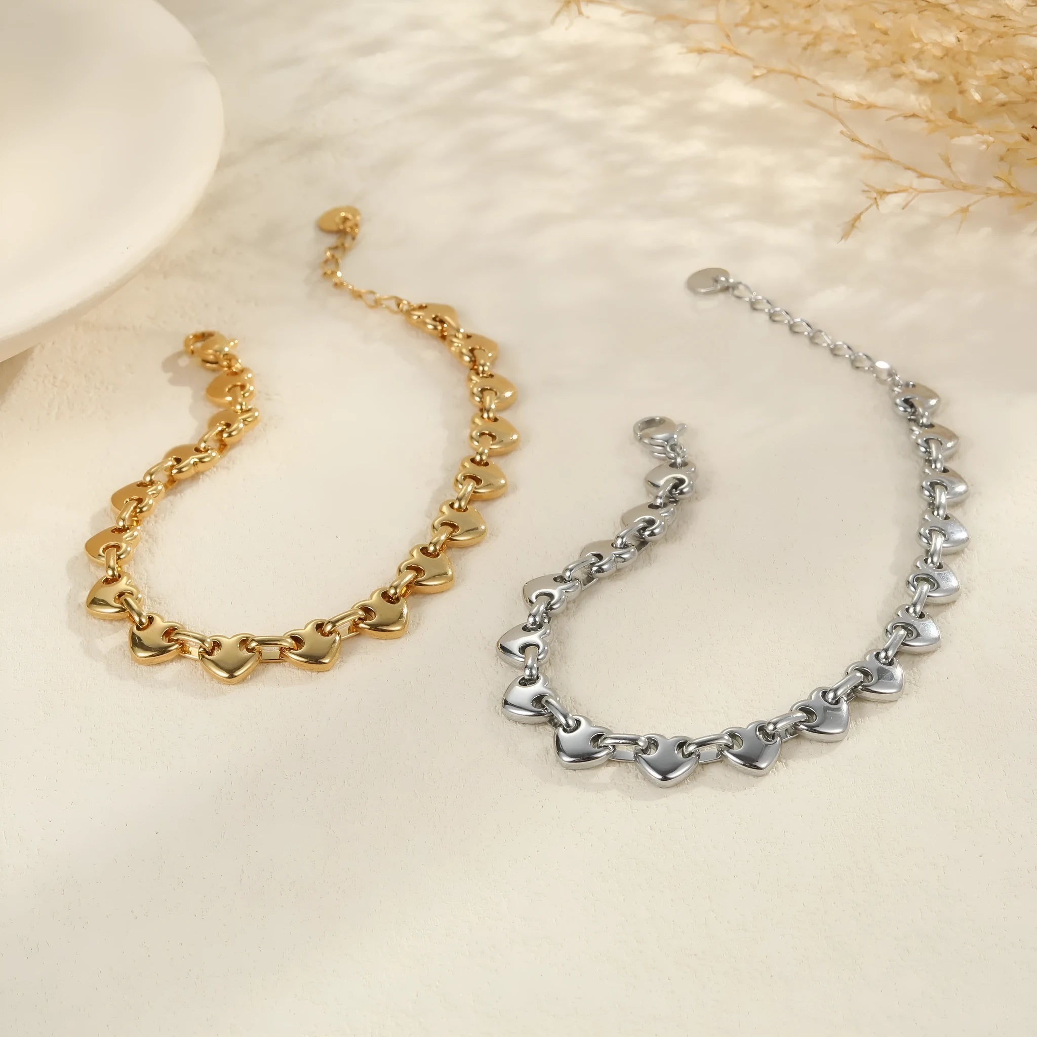 Stainless steel bracelet with hollowed-out heart design in gold electroplated finish for women
