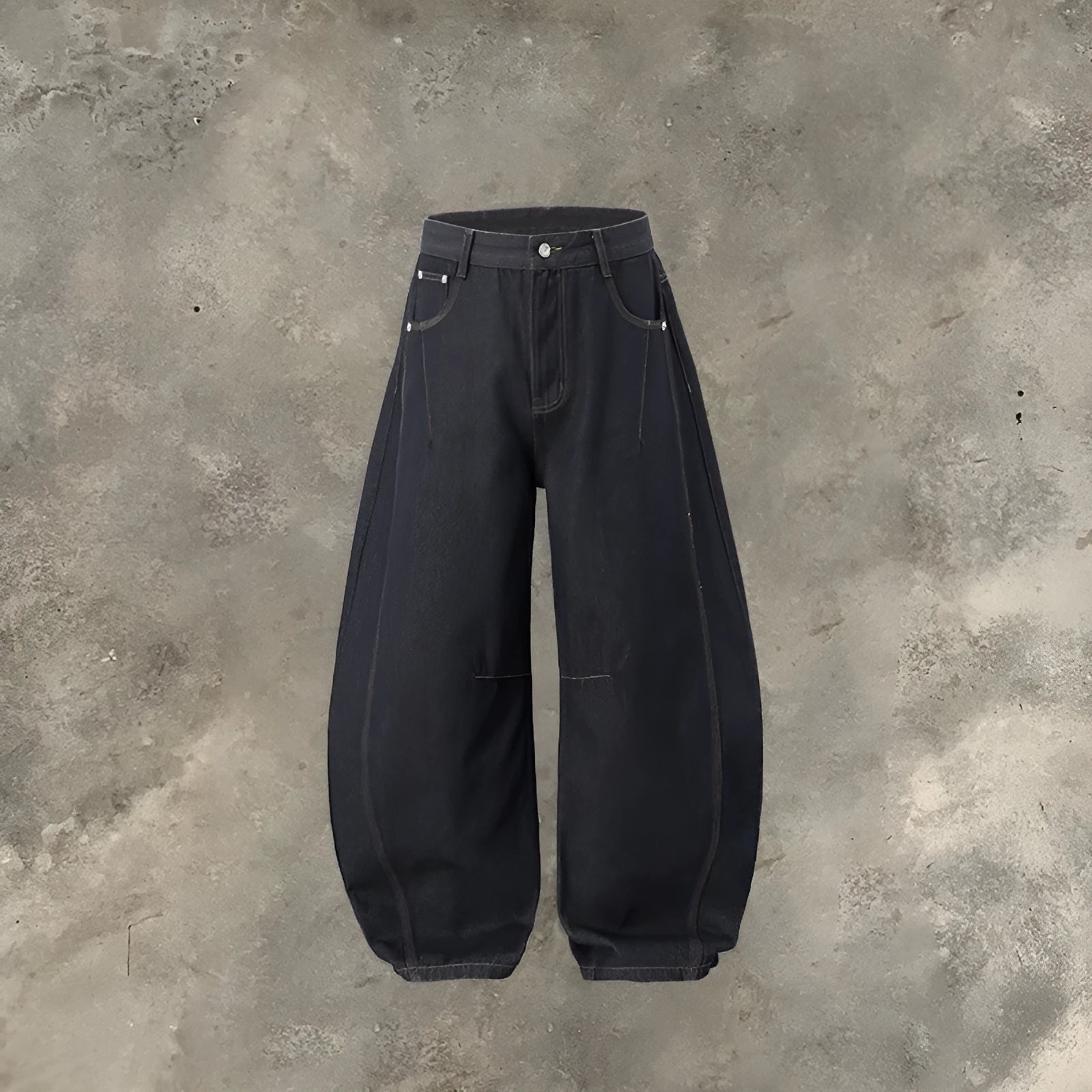 Men's wide leg cotton denim trousers in original cow colour, shown laid flat.