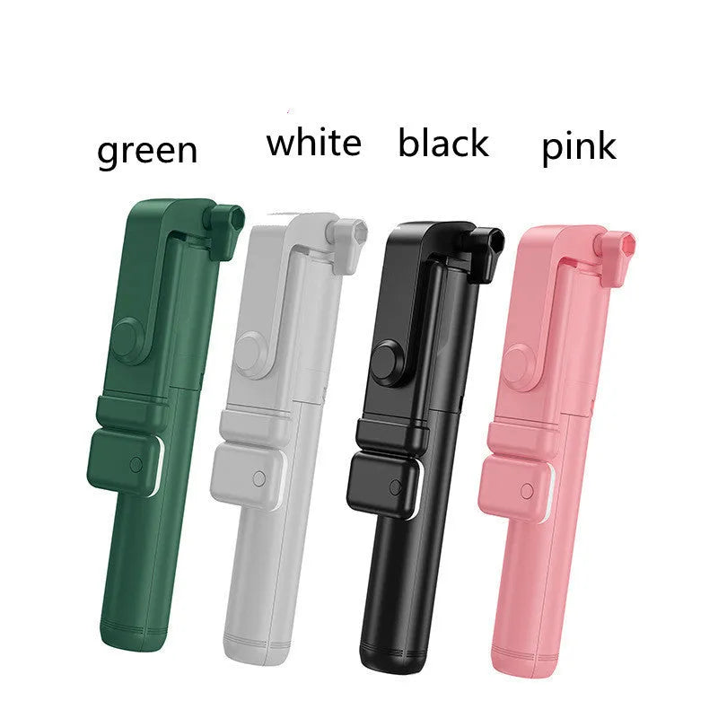 Black Bluetooth selfie stick with extended tripod legs and a fill light, holding an iPhone.